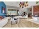 Sophisticated living room, featuring a curved sofa and unique lighting at 7436 Oak Grove Ave, Las Vegas, NV 89117