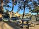 Relaxing picnic area near tennis courts, shaded by trees at 7436 Oak Grove Ave, Las Vegas, NV 89117