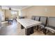 Dining area with marble top table and gray chairs at 7491 Speedwell Cavern St, Las Vegas, NV 89139