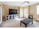 Living room with large TV and comfy furniture at 7491 Speedwell Cavern St, Las Vegas, NV 89139