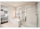 Bathroom with bathtub, shower, and view into bedroom at 7700 Tierra Montanosa Ave, Las Vegas, NV 89179