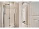 Small bathroom with shower and access to other rooms at 7700 Tierra Montanosa Ave, Las Vegas, NV 89179