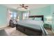 King bedroom with light teal walls and a sitting area at 7700 Tierra Montanosa Ave, Las Vegas, NV 89179