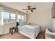 Bright bedroom with a comfortable bed and plenty of natural light at 7700 Tierra Montanosa Ave, Las Vegas, NV 89179