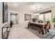 Formal dining room with a wooden table and bench seating at 7700 Tierra Montanosa Ave, Las Vegas, NV 89179