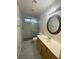 Updated bathroom with marble shower and vanity at 7732 Beverly Hills Dr, Las Vegas, NV 89147