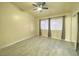 Bright bedroom with ceiling fan and tile flooring at 7732 Beverly Hills Dr, Las Vegas, NV 89147