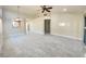 Spacious living room featuring tile flooring and a ceiling fan at 7732 Beverly Hills Dr, Las Vegas, NV 89147