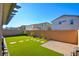 Artificial turf backyard with covered patio and sitting area at 859 Benning St, Henderson, NV 89011