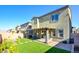 Artificial turf backyard with covered patio and sitting area at 859 Benning St, Henderson, NV 89011