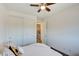 Bright bedroom with ceiling fan, double closet, and access to laundry at 859 Benning St, Henderson, NV 89011