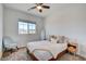 Bright bedroom with a queen bed, armchair, and decorative pillows at 859 Benning St, Henderson, NV 89011