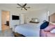 Large bedroom with king bed, plenty of light, and a sitting area at 859 Benning St, Henderson, NV 89011