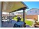 Covered patio with seating, grill, and string lights at 859 Benning St, Henderson, NV 89011