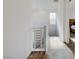 Upstairs hallway with carpet, window, and simple white walls at 859 Benning St, Henderson, NV 89011