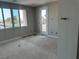 Spacious bedroom with large windows and door access at 8629 Ensworth St 113, Las Vegas, NV 89123