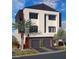 Modern two-story home with attached garage and landscaped front yard at 8629 Ensworth St 113, Las Vegas, NV 89123