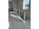 Modern staircase with metal railing and white base at 8629 Ensworth St 113, Las Vegas, NV 89123