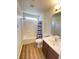 Clean bathroom with tub, shower, and vanity at 8970 College Green St, Las Vegas, NV 89148