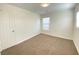 Well-lit bedroom with carpet and a window at 8970 College Green St, Las Vegas, NV 89148