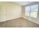 Bright bedroom featuring a large window and carpet flooring at 8970 College Green St, Las Vegas, NV 89148