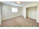 Bright bedroom with carpet, window, and closet at 8970 College Green St, Las Vegas, NV 89148