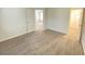 Bright bedroom with carpet flooring and access to other rooms at 8970 College Green St, Las Vegas, NV 89148