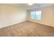 Spacious bedroom with a large window and neutral decor at 8970 College Green St, Las Vegas, NV 89148