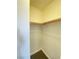 Good sized closet with wood shelving and rod at 8970 College Green St, Las Vegas, NV 89148