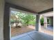 Covered patio with view of backyard and landscaping at 8970 College Green St, Las Vegas, NV 89148