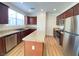 Modern kitchen with stainless steel appliances and island at 8970 College Green St, Las Vegas, NV 89148