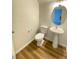 Clean powder room with pedestal sink and toilet at 8970 College Green St, Las Vegas, NV 89148