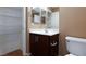 Bathroom with vanity, toilet and wire shelving at 9378 Hilgard Ave, Las Vegas, NV 89178