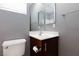 Bathroom with vanity, toilet and a large mirror at 9378 Hilgard Ave, Las Vegas, NV 89178