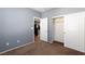 Bedroom with neutral walls, carpet, and a large closet at 9378 Hilgard Ave, Las Vegas, NV 89178