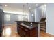 Kitchen island with granite countertop, view of stairs at 9378 Hilgard Ave, Las Vegas, NV 89178