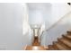 Well-lit interior staircase with wood flooring and neutral walls at 9378 Hilgard Ave, Las Vegas, NV 89178