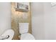 Small bathroom with gold-toned wall tiles and a pedestal sink at 9635 Stoney Mesa Ct, Las Vegas, NV 89139