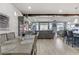 Open dining area with wood table and view into the living room at 9635 Stoney Mesa Ct, Las Vegas, NV 89139