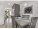 Dining area with farmhouse style table, adjacent to entryway at 9635 Stoney Mesa Ct, Las Vegas, NV 89139