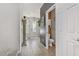 Hallway with a powder room and view to the front door at 9635 Stoney Mesa Ct, Las Vegas, NV 89139