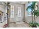 Elegant entryway with a glass-paned front door and potted plants at 9635 Stoney Mesa Ct, Las Vegas, NV 89139