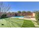 Inviting pool and spa with a putting green at 9635 Stoney Mesa Ct, Las Vegas, NV 89139