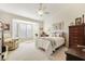 Relaxing main bedroom with bay window and ceiling fan at 9921 Woodhouse Dr, Las Vegas, NV 89134