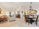 Elegant dining area with a table for four and stylish light fixture at 9921 Woodhouse Dr, Las Vegas, NV 89134