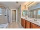 Double vanity bathroom with large shower and separate tub at 9936 Fountain Walk Ave, Las Vegas, NV 89149