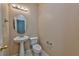 Small bathroom with pedestal sink and toilet at 9936 Fountain Walk Ave, Las Vegas, NV 89149