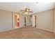 Bright bedroom featuring a ceiling fan and en-suite bathroom access at 9936 Fountain Walk Ave, Las Vegas, NV 89149