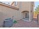 Small backyard with gravel and sliding glass door access at 9936 Fountain Walk Ave, Las Vegas, NV 89149