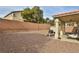 Large backyard with covered patio, grill, and storage shed at , Las Vegas, NV 89148